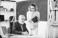 Explaining difficult topic. Student puzzled by some information. School education concept. Check homework. Educator and