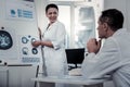 Scientist explaining the processes in brain to her colleague