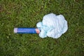 An exploded cylinder with construction foam on the grass. Balloon defect, close-up