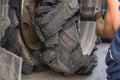 Destroyed blown tire with crushed and damaged rubber on a truck.