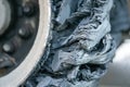 Destroyed blown tire with crushed and damaged rubber on a truck. Royalty Free Stock Photo