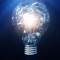 Exploding light bulb on a blue background, with concept creative thinking and innovative solutions. 3D rendering Royalty Free Stock Photo