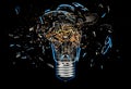 Exploding light bulb on a blue background, Royalty Free Stock Photo