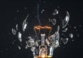 Exploding light bulb captures moment of innovation and destruction dynamic shattered glass effect Royalty Free Stock Photo