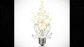 Exploding Light Bulb with Glowing Particles and Shattered Glass Royalty Free Stock Photo