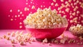 popcorn in a glass bowl on a bright pink background Royalty Free Stock Photo