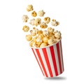 Exploding popcorn in a red and white striped bucket Royalty Free Stock Photo