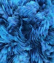 closeup of an exploding 3D turquoise blue coloured surface