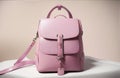 Explore the Beauty of a Pink Women\'s Handbag Backpack on a Trendy Dark Pink Studio Backgroun.