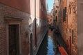 Explore the charm of Venice with this picturesque scene of gondolas on a narrow canal. Royalty Free Stock Photo