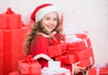 Explore christmas gifts. Unpacking christmas gift. Kid excited about opening christmas present. Girl celebrate christmas Royalty Free Stock Photo