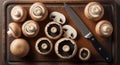 Fresh brown mushrooms on cutting board with knife: cooking, recipes, and nutrition Royalty Free Stock Photo