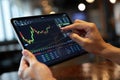 Analyzing stock market data on a tablet for financial growth and investment opportunities, a modern approach to wealth management Royalty Free Stock Photo