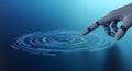 Futuristic robotic hand activates glowing digital interface ripples on a deep blue technology background. Royalty Free Stock Photo