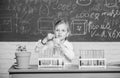 Explore and investigate. School lesson. Girl cute school pupil play with test tubes and colorful liquids. School Royalty Free Stock Photo