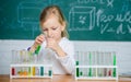 Future scientist. Explore and investigate. School lesson. Interesting approach to learn. Girl cute school pupil play Royalty Free Stock Photo