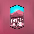 Explore more - modern colorful outdoor badge for wear. Purple landscape and blue sky and phrase `explore more`.
