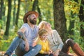 Explore nature together. Family day concept. Mom dad and kid boy relaxing while hiking in forest. Family picnic. Mother