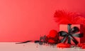 Explore pleasure with adult toys, furry handcuffs, feather tickler, and sprinkles. Side view photo, red background sets mood Royalty Free Stock Photo