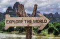 Explore the World wooden sign with a forest background Royalty Free Stock Photo