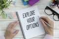 Explore Your Options write on sticky note isolated on Wooden Table. Royalty Free Stock Photo