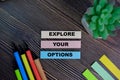 Explore Your Options write on sticky notes isolated on Wooden Table Royalty Free Stock Photo