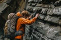 explorer with backpack touching flowstone Royalty Free Stock Photo