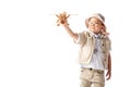 Explorer boy in glasses and hat holding wooden toy plane isolated on white