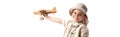 Explorer child in glasses and hat holding wooden toy plane isolated on white