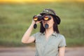 Explorer Girl with Camouflage Hat and Binoculars