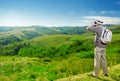 Explorer looking through binoculars outdoors Royalty Free Stock Photo