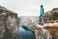 Explorer man standing on cliff over fjord solo traveling Royalty Free Stock Photo