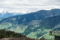 Explorer observes an outstanding panorama in the mountains