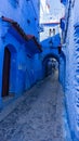 Exploring the Blue Painted Alleyway Royalty Free Stock Photo