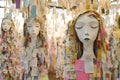 Paper art installation showcases delicate dolls with layered notes in a tranquil setting Royalty Free Stock Photo