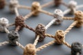 Exploring concept of social network connections through intertwined knots and threads, symbolizing relationships and communication Royalty Free Stock Photo
