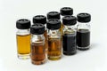 Exploring Diverse Liquid Samples: A Comprehensive Analysis of Various Viscosities and Hues in Small Glass Vials, Showcasing a