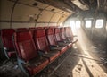 Exploring the Echoes of Flight A Glimpse Inside an Abandoned Airplanes Red Leather Interior Stunning Urban Exploration Royalty Free Stock Photo