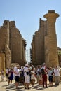 EXPLORING EGYPT - KARNAK TEMPLE - Travel tour group wanders through Karnak Temple. Beautiful Egyptian landmark with hieroglyphics Royalty Free Stock Photo