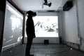 Exploring Immersive Virtual Reality, A Person Uses a Headset to Interact with Abstract 3D Visualizations Projected
