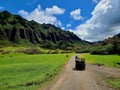 Exploring the mesmerizing landscapes with steep green hills in Oahu Island in offroad cars