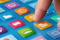 Exploring mobile applications with a finger navigating colorful icons on a touchscreen device. Generative AI