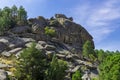 Exploring Mountains of stones seen from its hillside.