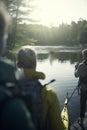 Exploring the Outdoors: Group Hiking and Camping by the River with Backpacks