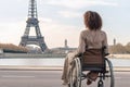 Exploring Paris as a wheelchair user. Back of disabled african american woman looking on Eiffel tower. Generative AI