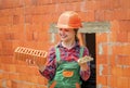 exploring tools. future engineer. happy kid use brick for renovation repairing. building construction site. child