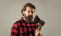 exploring tools. male casual fashion style. handsome hipster with axe. logger or axeman concept