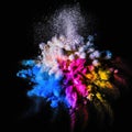 Explosion of colorful powder isolated on dark black background. Holi paint color dust explode in freeze motion. Generative AI Royalty Free Stock Photo