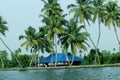 A food kiosk at the bank of the river surrounded by beautiful palm trees, Kerala backwaters Royalty Free Stock Photo