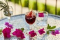 Explosion of elegant and colorful glass of red wine, wine splash in the glass. Summer cocktails on the background Royalty Free Stock Photo